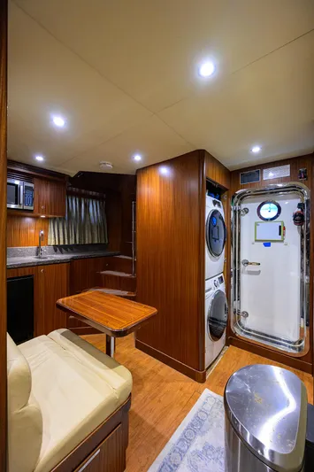 Claypen Yacht Photos Pics Luxurious 2013 Ocean Alexander Sky Lounge interior with kitchen, seating, and laundry area.