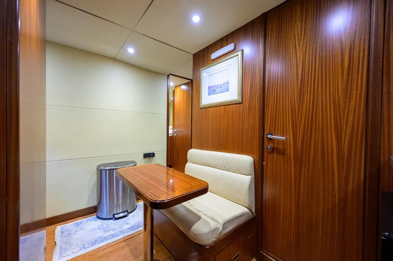 Claypen Yacht Photos Pics Luxurious interior of 2013 Ocean Alexander Sky Lounge with wood paneling and cozy seating.