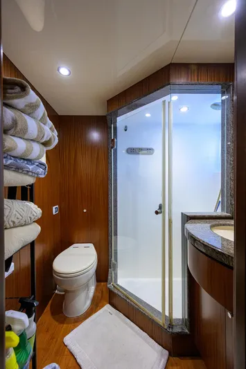 Claypen Yacht Photos Pics Luxurious bathroom in 2013 Ocean Alexander Sky Lounge yacht with shower and wooden accents.