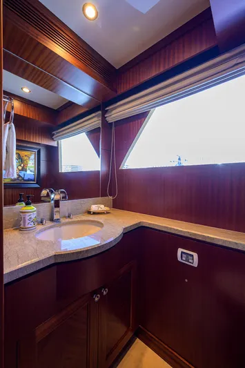 Claypen Yacht Photos Pics Luxurious bathroom interior of 2013 Ocean Alexander Sky Lounge yacht with wood accents and modern fixtures.
