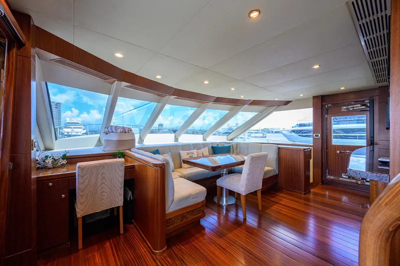 Claypen Yacht Photos Pics Luxurious interior of 2013 Ocean Alexander Sky Lounge yacht with elegant wood finishes and panoramic windows.