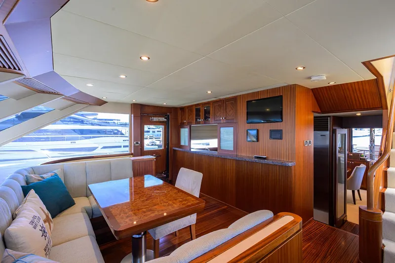 Claypen Yacht Photos Pics Luxurious interior of 2013 Ocean Alexander Sky Lounge yacht with elegant wood finishes and seating area.