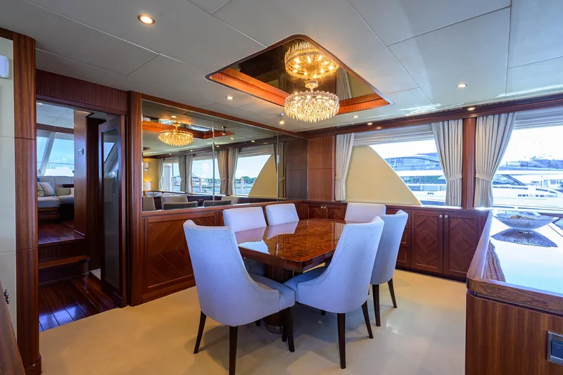Claypen Yacht Photos Pics Luxurious dining area on 2013 Ocean Alexander Sky Lounge yacht with elegant chandelier.