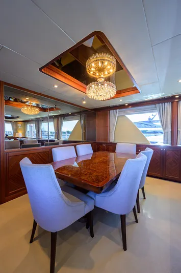 Claypen Yacht Photos Pics Luxurious dining area on 2013 Ocean Alexander Sky Lounge yacht with elegant chandelier.