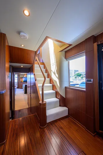 Claypen Yacht Photos Pics Interior of 2013 Ocean Alexander Sky Lounge yacht with elegant wooden staircase and modern design.