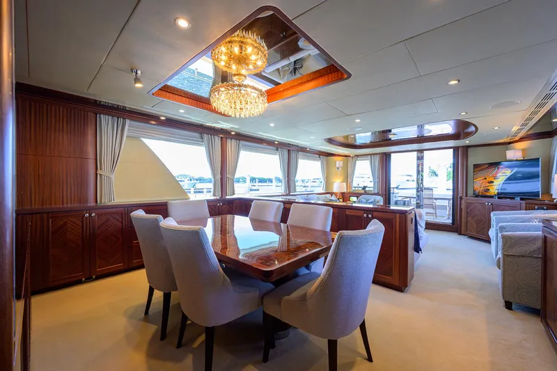 Claypen Yacht Photos Pics Luxurious interior of 2013 Ocean Alexander Sky Lounge yacht with elegant dining area and chandelier.