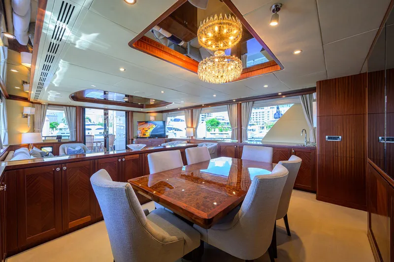 Claypen Yacht Photos Pics Luxurious interior of 2013 Ocean Alexander Sky Lounge yacht with elegant dining area and chandelier.