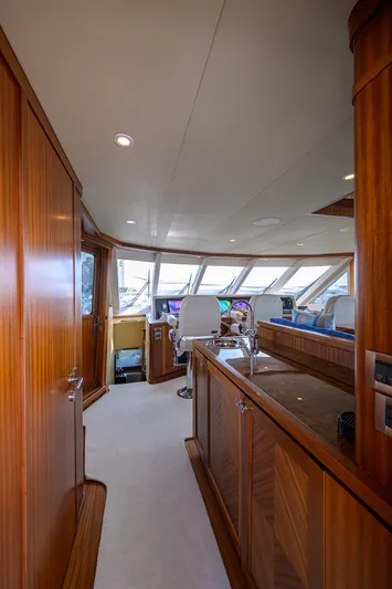 Claypen Yacht Photos Pics Luxurious 2013 Ocean Alexander Sky Lounge interior with wood paneling and modern helm.