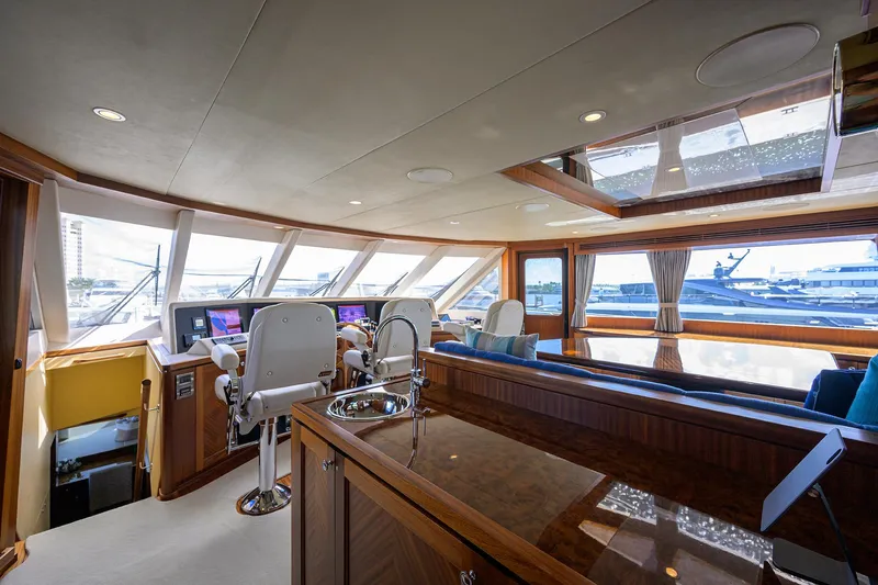 Claypen Yacht Photos Pics Luxurious 2013 Ocean Alexander Sky Lounge interior with helm, seating, and panoramic windows.