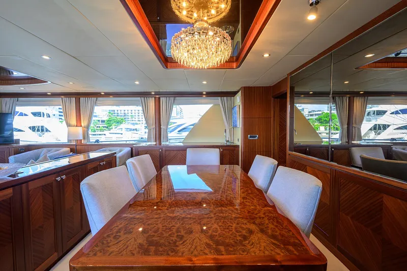 Claypen Yacht Photos Pics Luxurious dining area on 2013 Ocean Alexander Sky Lounge yacht with elegant chandelier.