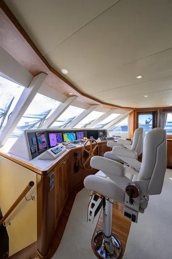 Claypen Yacht Photos Pics Luxurious 2013 Ocean Alexander Sky Lounge interior with modern navigation equipment and plush seating.