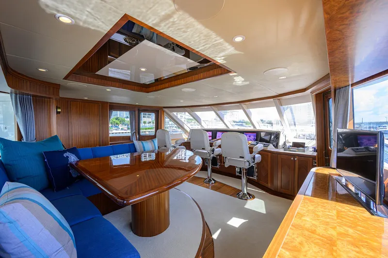 Claypen Yacht Photos Pics Luxurious interior of 2013 Ocean Alexander Sky Lounge yacht with plush seating and panoramic windows.