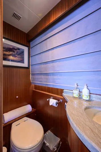 Claypen Yacht Photos Pics Luxurious bathroom in 2013 Ocean Alexander Sky Lounge yacht with elegant wood paneling.