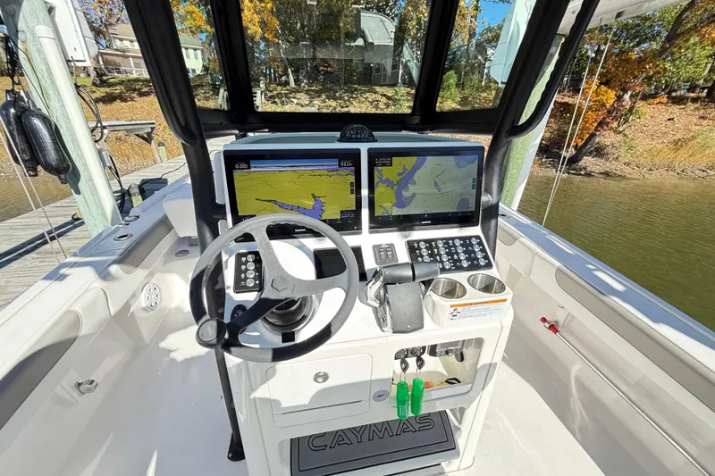  Yacht Photos Pics 2023 Caymas 281 HB boat cockpit with advanced navigation system and steering wheel.