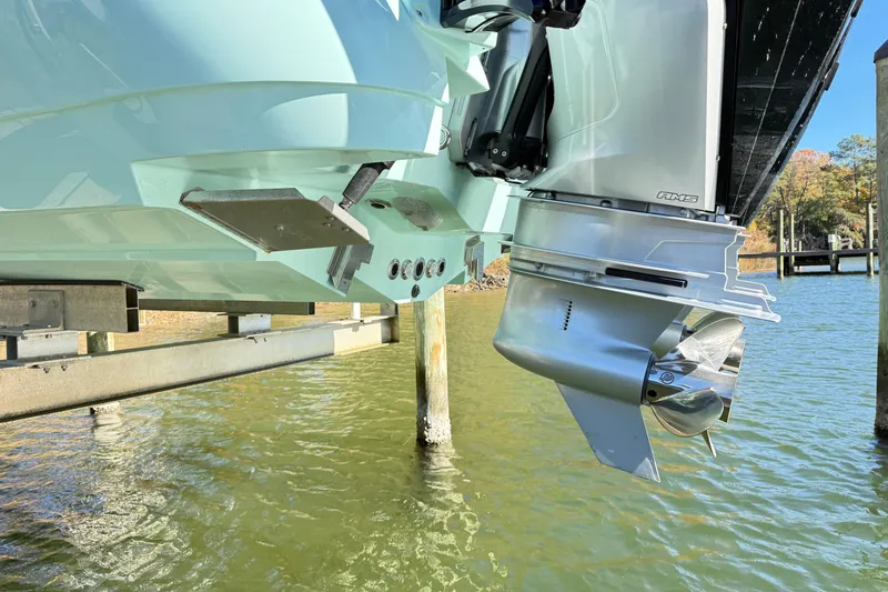  Yacht Photos Pics 2023 Caymas 281 HB boat engine and propeller above water.