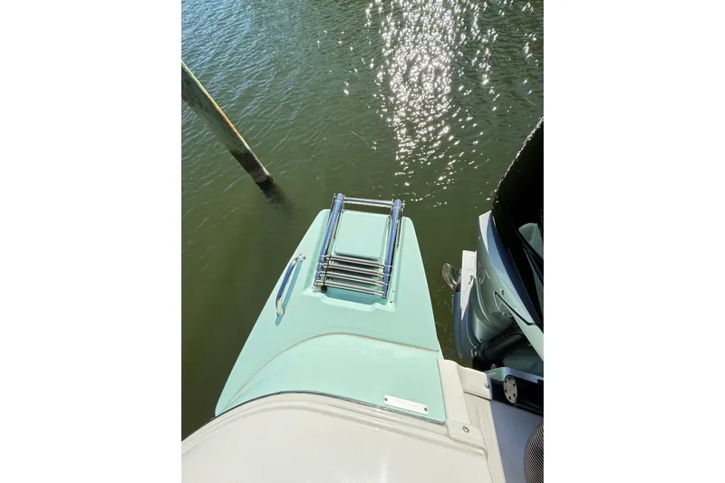  Yacht Photos Pics 2023 Caymas 281 HB boat with swim platform and ladder on water.