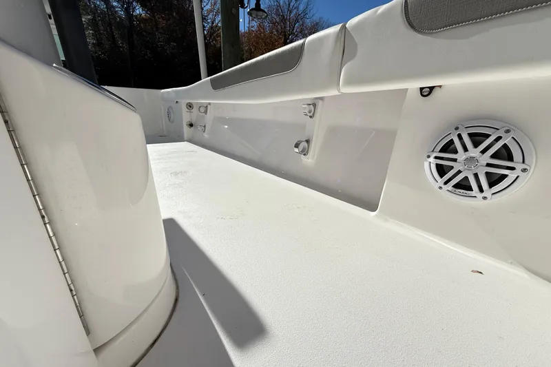  Yacht Photos Pics 2023 Caymas 281 HB boat interior with speaker and seating detail.