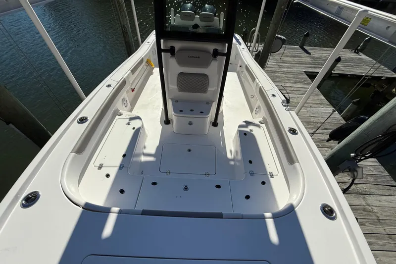  Yacht Photos Pics 2023 Caymas 281 HB boat deck view, docked by the water.