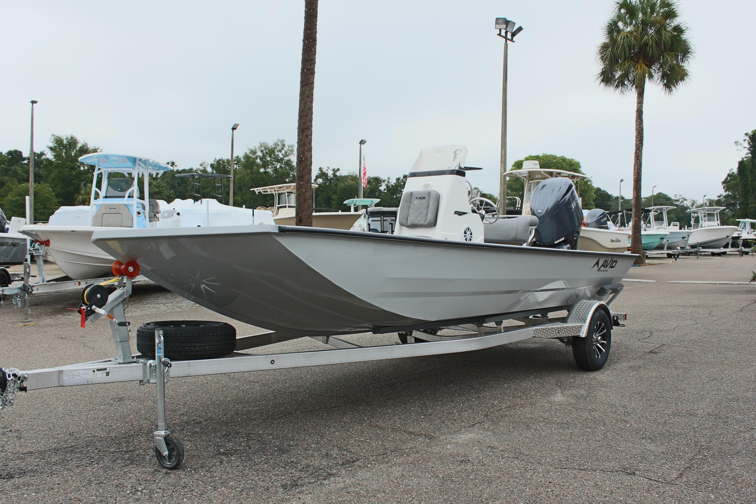 2026 Avid 20 Rogue CC boat on trailer in outdoor showroom.