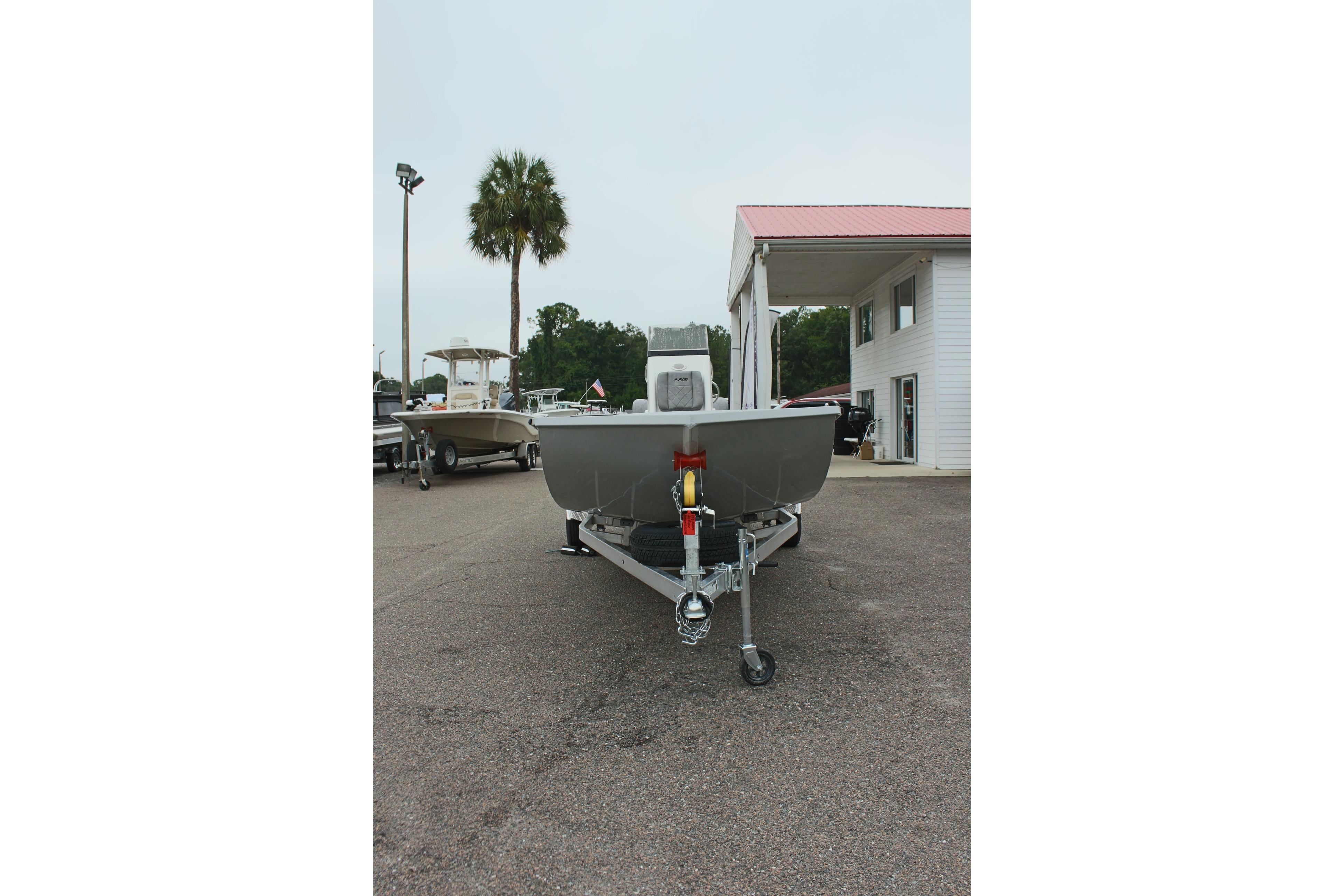 2026 Avid 20 Rogue CC boat on trailer in dealership lot.