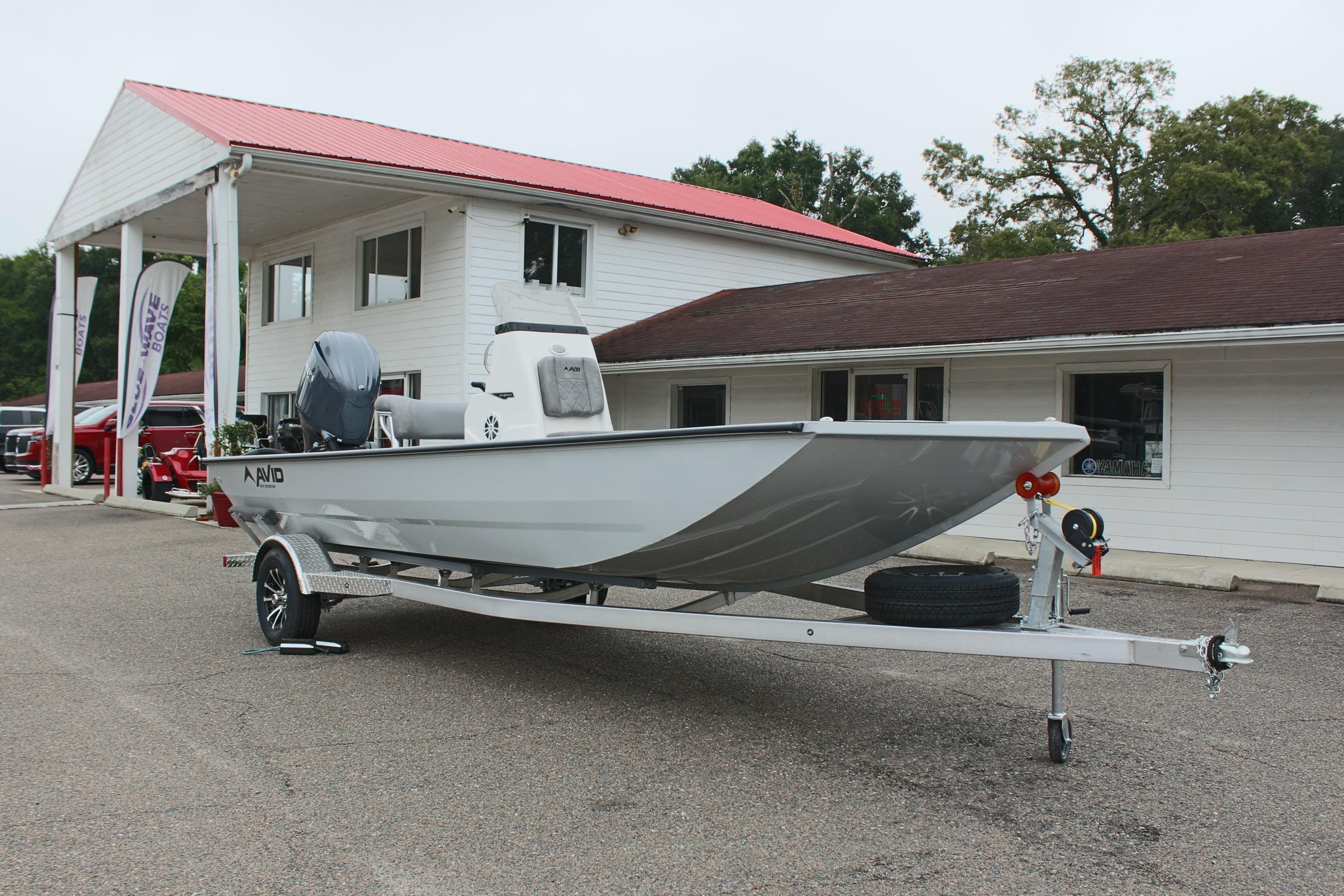 2026 Avid 20 Rogue CC boat on trailer outside dealership.