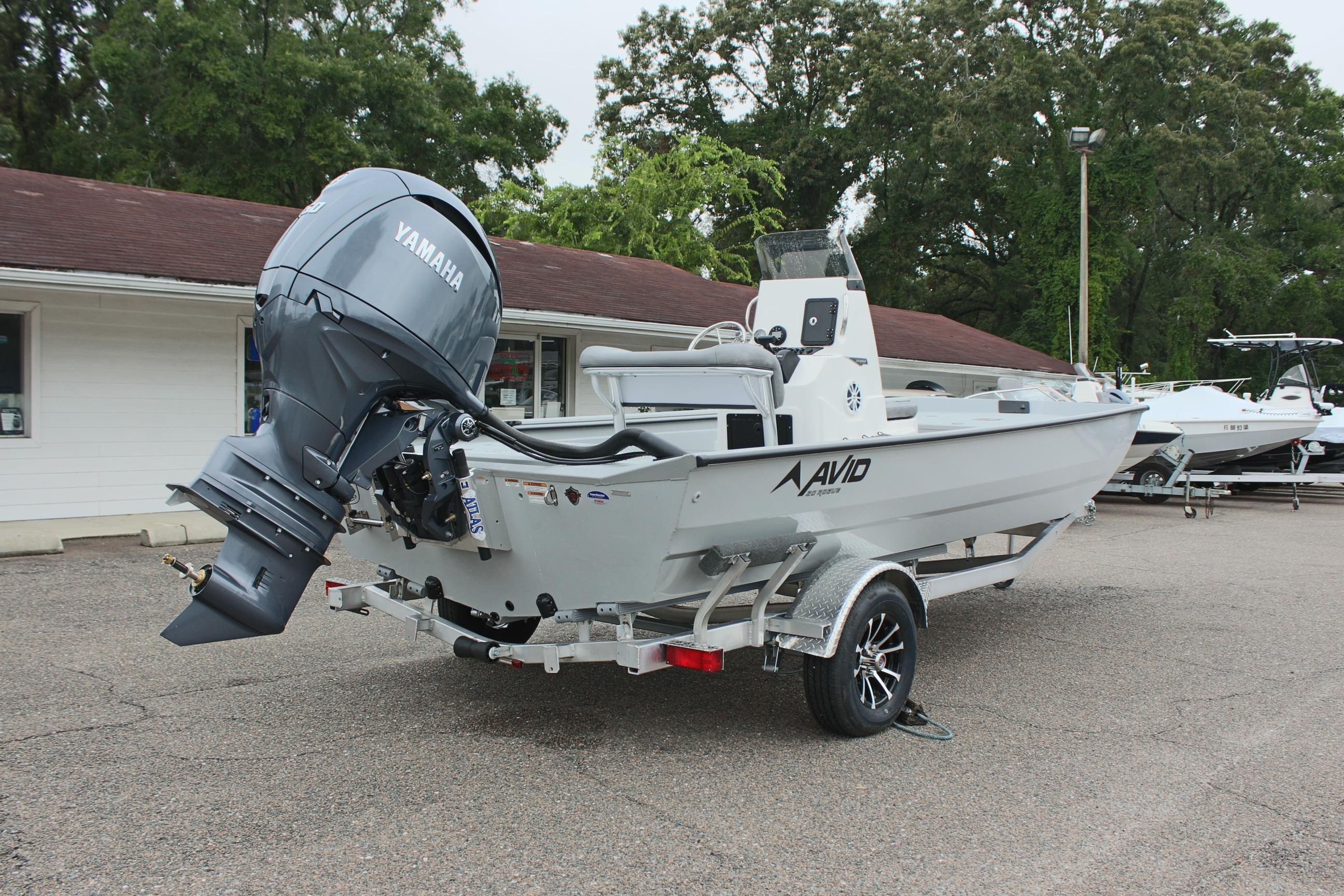2026 Avid 20 Rogue CC boat with Yamaha engine on trailer, parked outdoors.