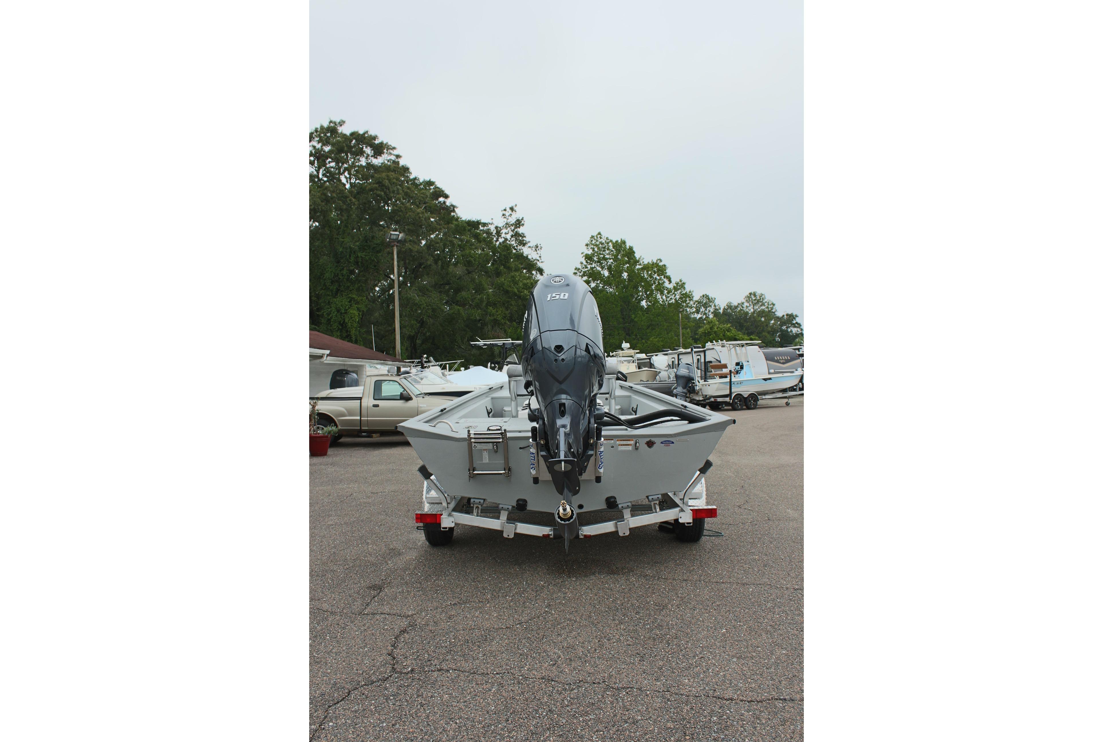 2026 Avid 20 Rogue CC boat on trailer, rear view, parked outdoors.