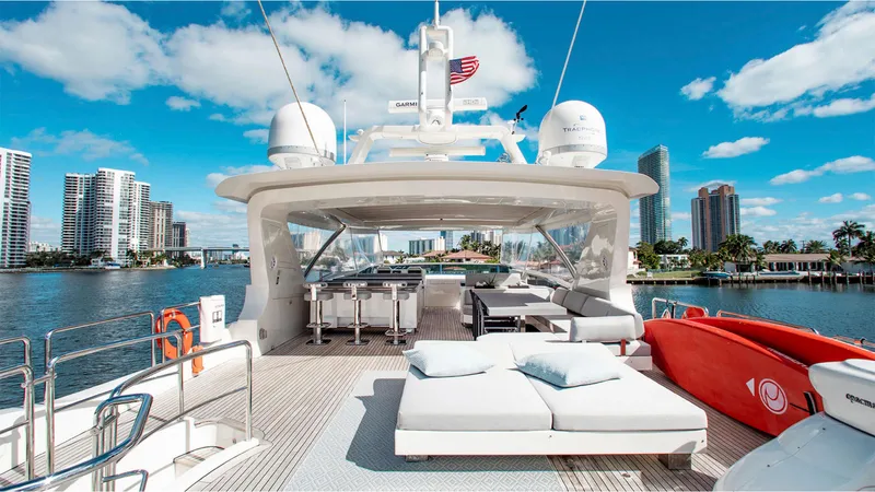 Bt2 Yacht Photos Pics Luxurious 2010 Azimut 95 yacht deck with city skyline and blue sky.