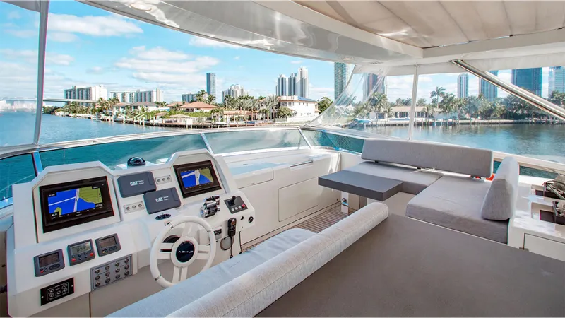 Bt2 Yacht Photos Pics Luxurious 2010 Azimut 95 yacht interior with modern helm and seating, overlooking a scenic waterfront.