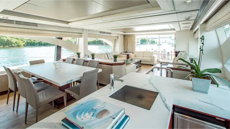 Bt2 Yacht Photos Pics Luxurious interior of 2010 Azimut 95 yacht with elegant dining and lounge area.