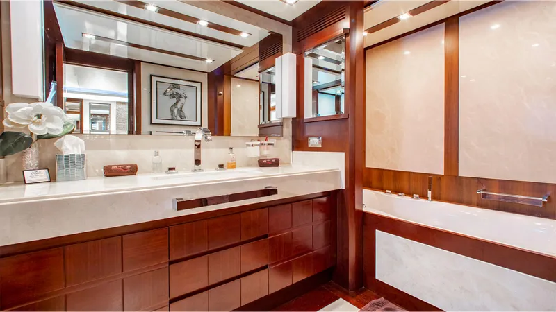Bt2 Yacht Photos Pics Luxurious bathroom in 2010 Azimut 95 yacht, featuring elegant wood and marble finishes.