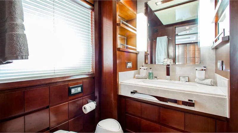 Bt2 Yacht Photos Pics Luxurious bathroom interior on 2010 Azimut 95 yacht, featuring elegant wood finishes and modern amenities.
