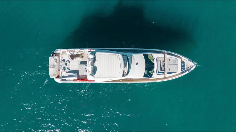 Bt2 Yacht Photos Pics Overhead view of a 2010 Azimut 95 yacht on clear blue water.