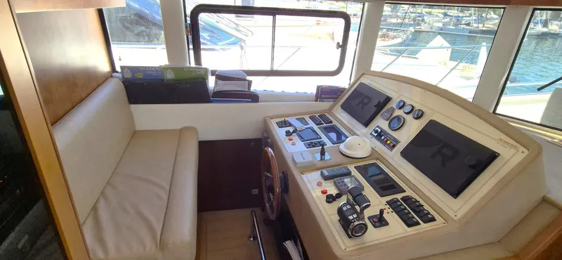Getaway Yacht Photos Pics Gianetti Navetta 67 yacht helm with navigation controls and seating, 2012 model.