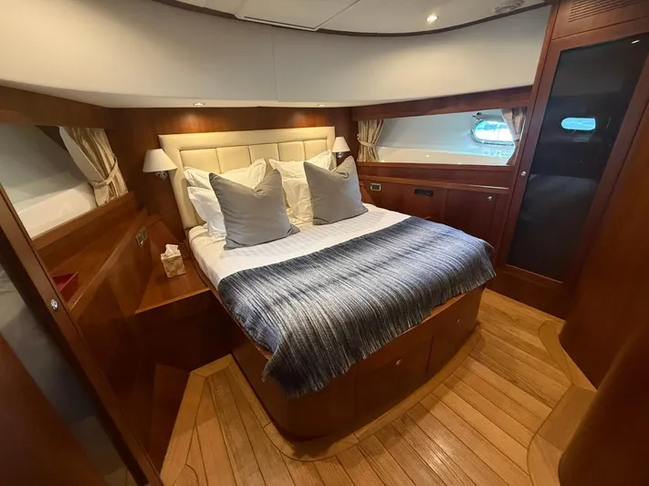 Getaway Yacht Photos Pics Luxurious bedroom interior of 2012 Gianetti Navetta 67 yacht with elegant wood finish.