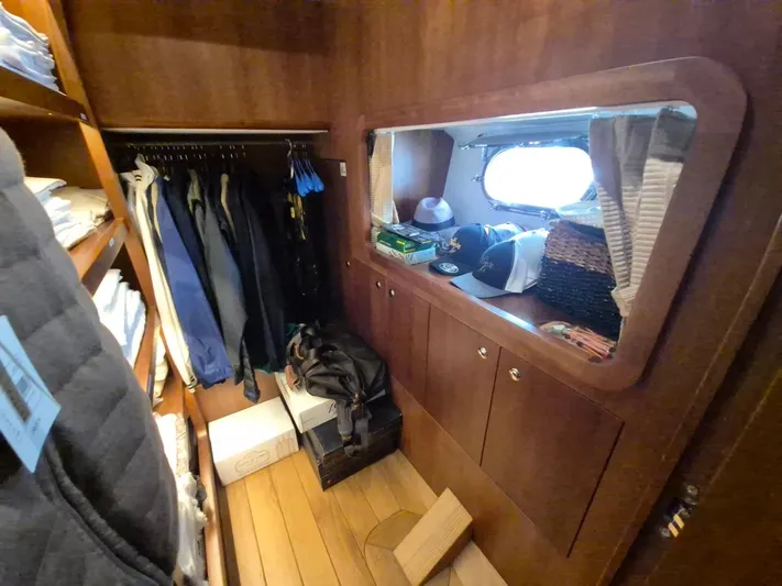 Getaway Yacht Photos Pics Closet interior of 2012 Gianetti Navetta 67 yacht with clothes and accessories.