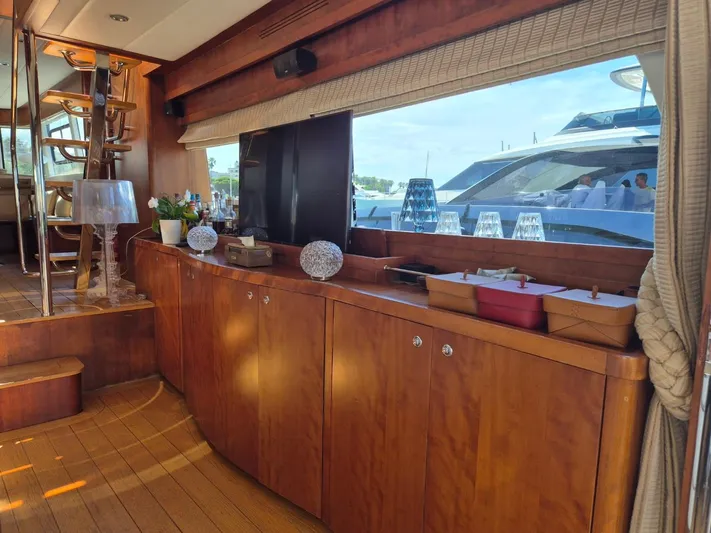 Getaway Yacht Photos Pics Luxurious interior of 2012 Gianetti Navetta 67 yacht with wooden cabinetry and elegant decor.