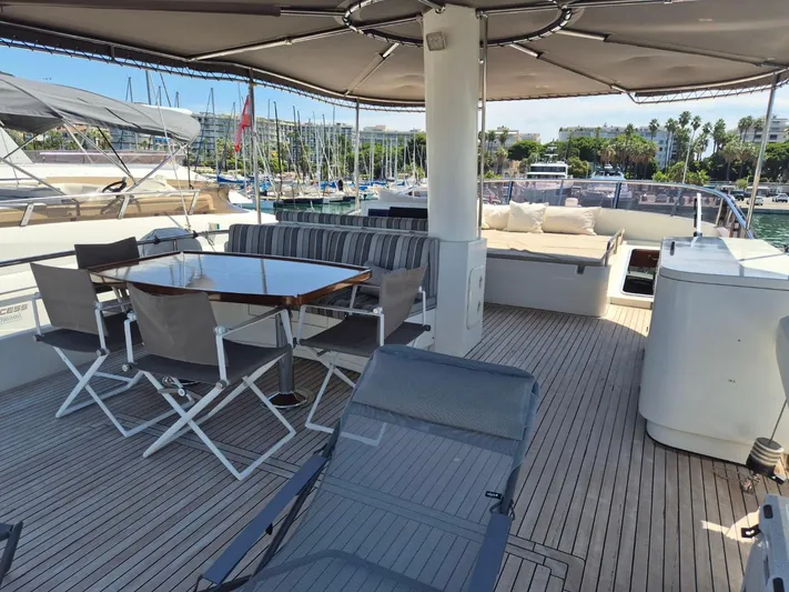 Getaway Yacht Photos Pics Luxurious 2012 Gianetti Navetta 67 yacht deck with seating and dining area.