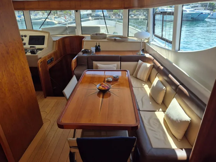 Getaway Yacht Photos Pics Luxurious interior of 2012 Gianetti Navetta 67 yacht with elegant dining area and scenic views.