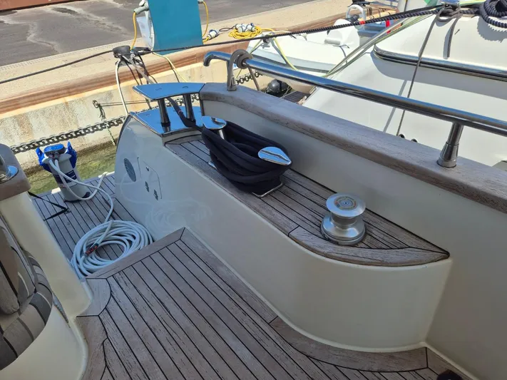 Getaway Yacht Photos Pics Deck of 2012 Gianetti Navetta 67 yacht with wooden flooring and nautical equipment.