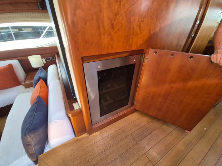 Getaway Yacht Photos Pics Interior of 2012 Gianetti Navetta 67 yacht with wooden cabinetry and seating area.