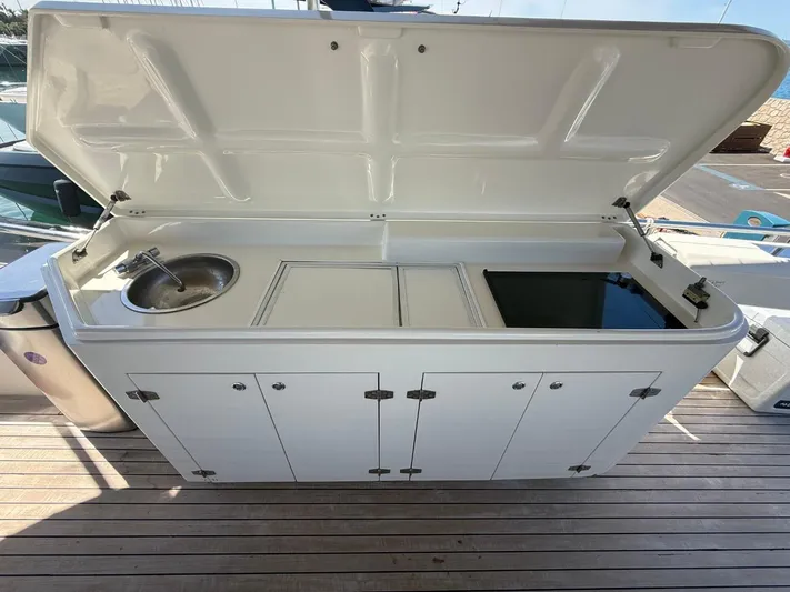 Getaway Yacht Photos Pics Outdoor kitchen on 2012 Gianetti Navetta 67 yacht with sink and storage.