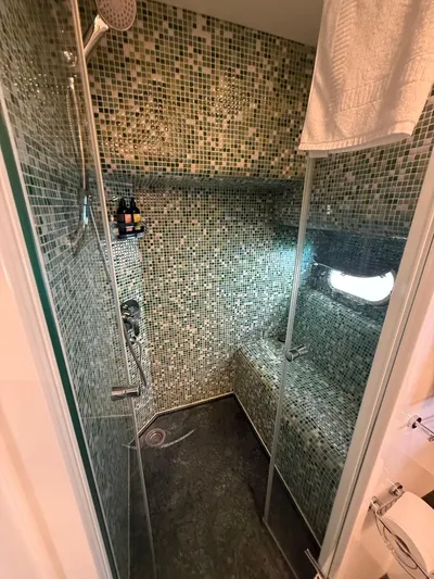 Getaway Yacht Photos Pics Luxurious mosaic-tiled shower in 2012 Gianetti Navetta 67 yacht bathroom.