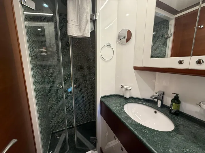 Getaway Yacht Photos Pics Luxurious bathroom in 2012 Gianetti Navetta 67 yacht with modern shower and elegant sink.