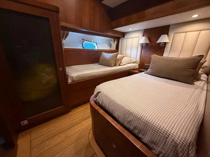 Getaway Yacht Photos Pics Luxurious cabin interior of 2012 Gianetti Navetta 67 yacht with twin beds and elegant wood finish.