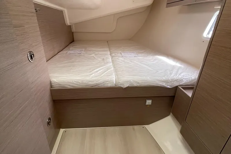 Silver Alert Yacht Photos Pics 2021 Hanse 418 yacht cabin with twin beds, modern wood finish, and natural light.
