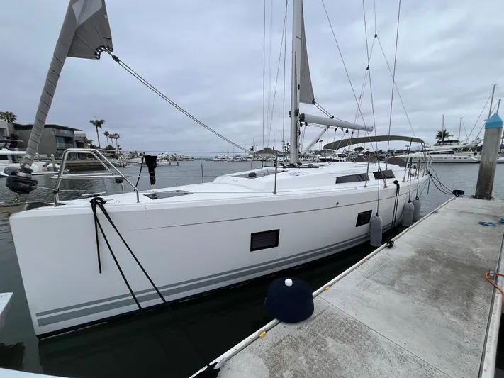 Silver Alert Yacht Photos Pics 2021 Hanse 418 yacht docked at marina under cloudy sky.