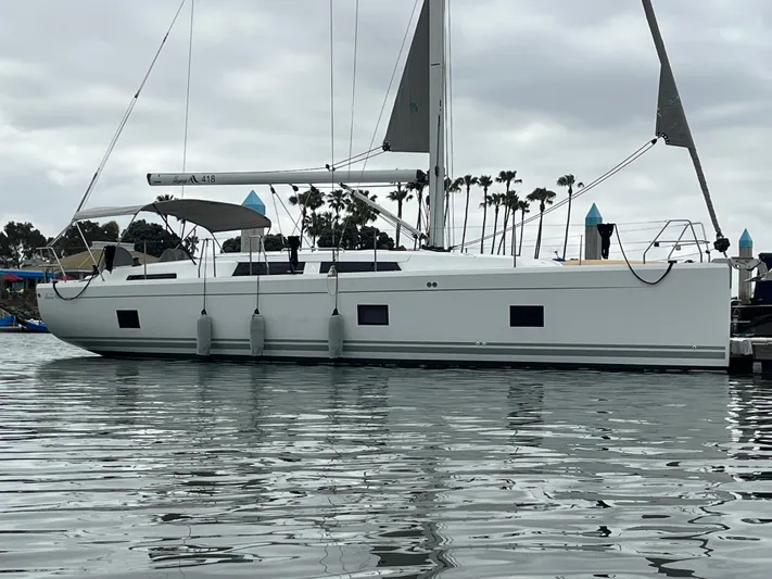Silver Alert Yacht Photos Pics 2021 Hanse 418 yacht docked in a marina with overcast skies.