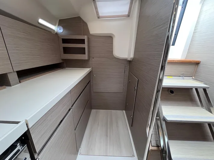 Silver Alert Yacht Photos Pics Modern interior of 2021 Hanse 418 yacht with sleek cabinetry and compact design.