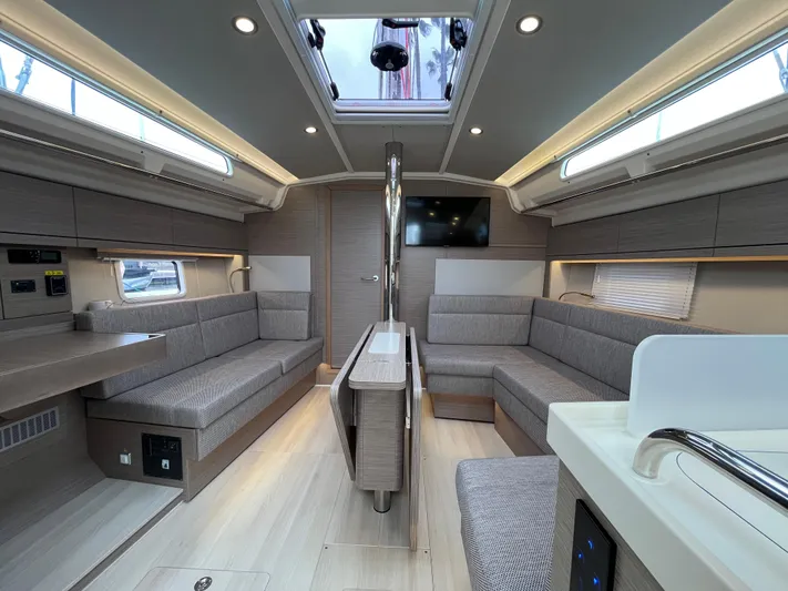 Silver Alert Yacht Photos Pics Luxurious interior of 2021 Hanse 418 yacht with modern seating and skylight.
